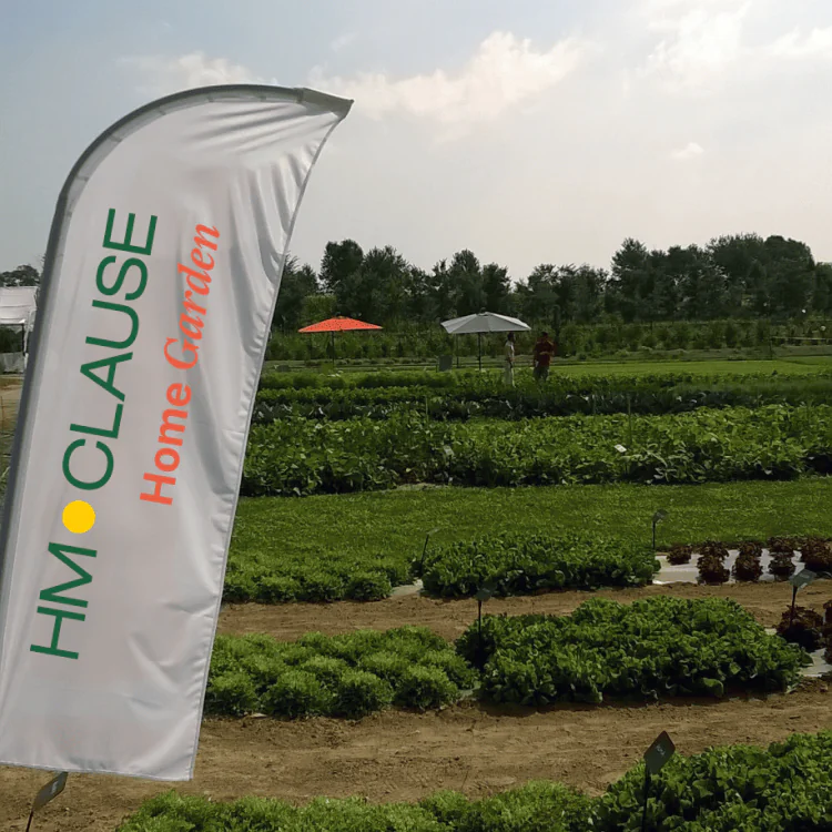 Logo HM CLAUSE HOME GARDEN drapeau jardin d'essai